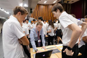 students and teacher at CAS fair